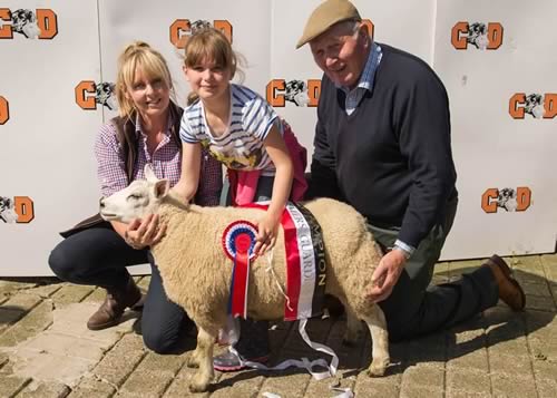 Alexandra Bouch, Pump Cottage winner of Longtown Mart Young Handlers Prime Lamb Show – with Steph Ryder from Farmers Guardian who sponsored the event and Chris Brodie the judge