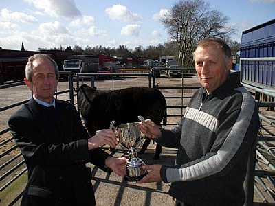 Champion British Blue X Bullock 15 month old, 465 Kg, Picture Left to Right S Ferguson (Sponsored by Carrs Billington) and Mr W McKie, High Threave